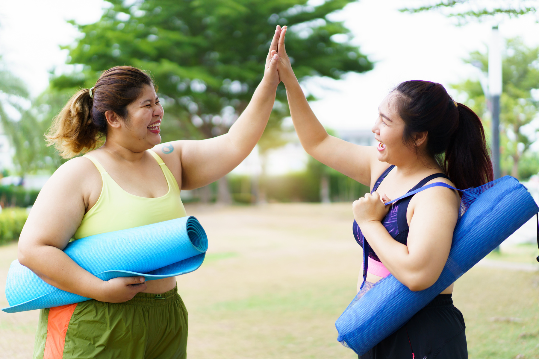 Oversize women exercise outdoor.