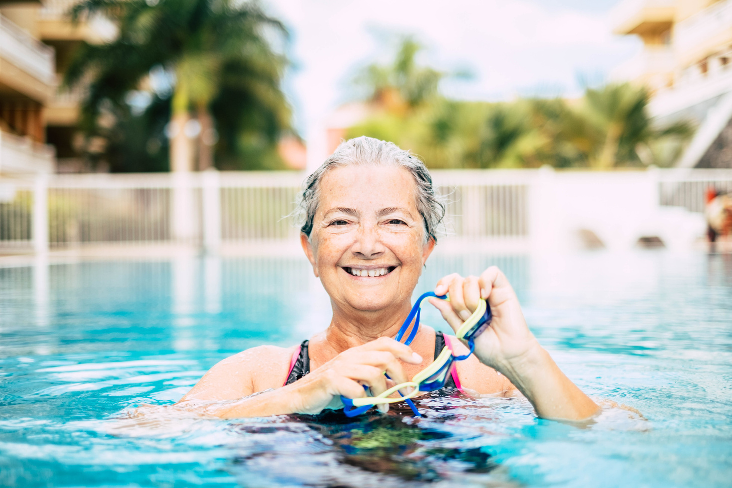 Mature Woman Doing Activity at the Pool Swimming and Training 